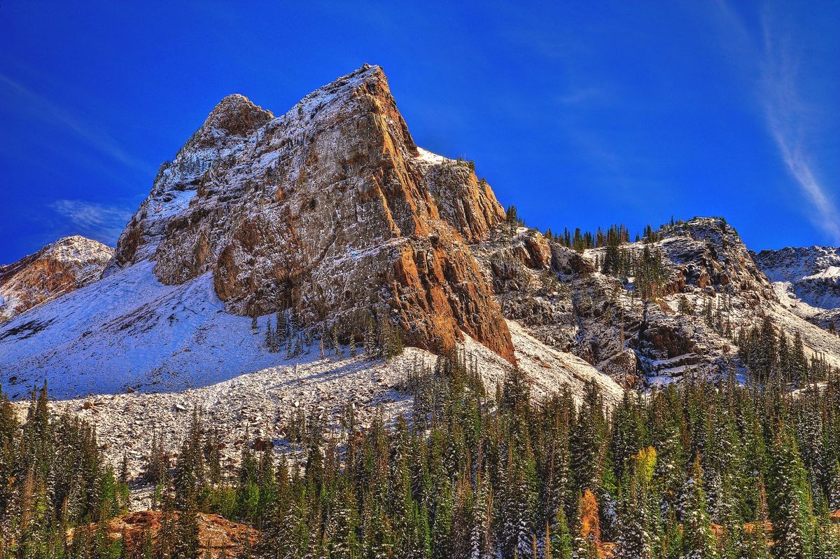 Early spring leaves behind signs of winter's grip on Sundial Peak and Lake Blanche, part of the Twin Peaks Wilderness in the Wasatch Mountains above Salt Lake City, Utah, USA.